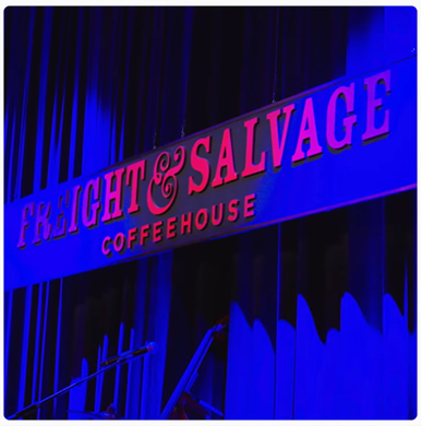 Freight & Salvage Coffeehouse stage sign lit by blue light