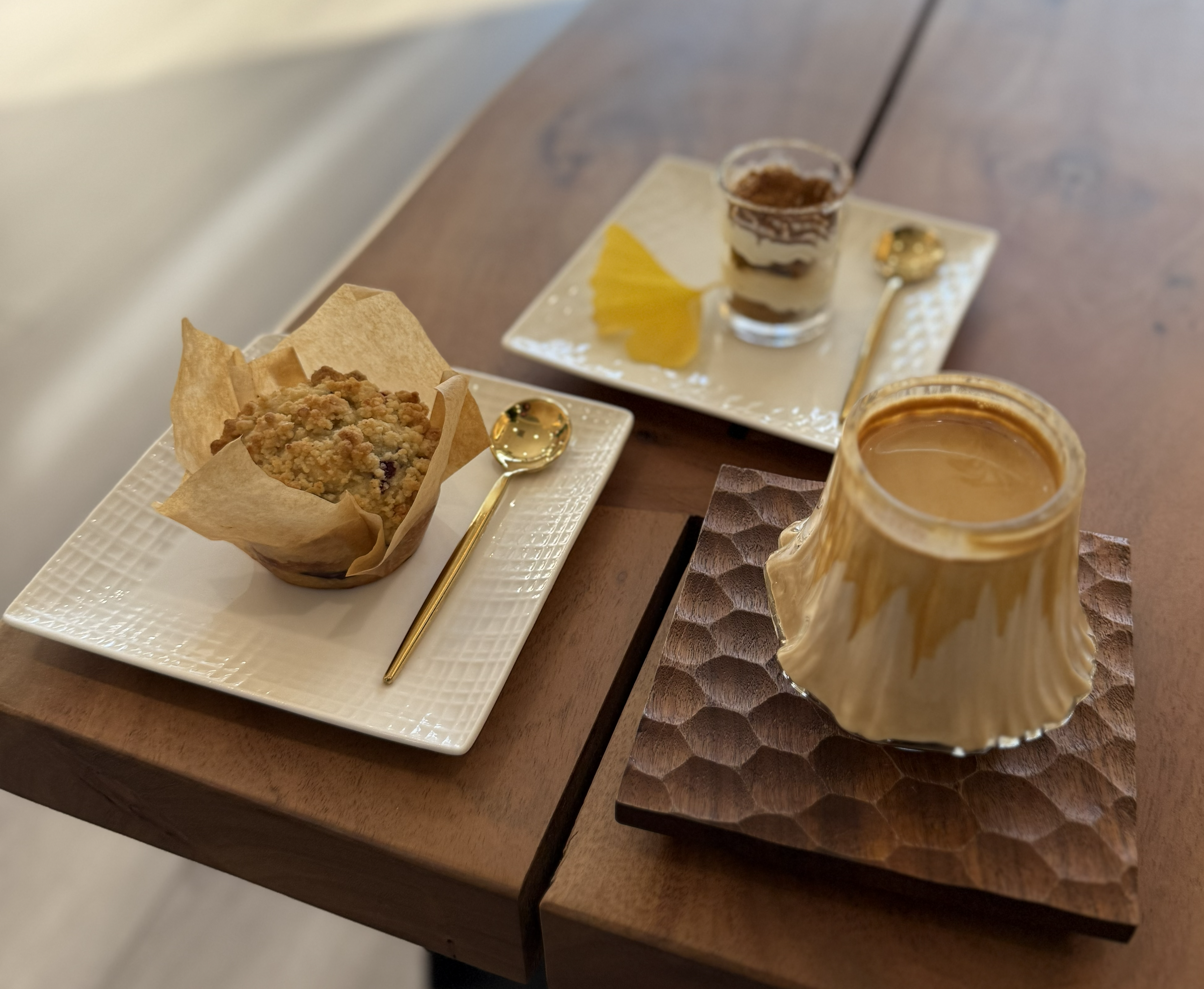 Tiramisu, muffin, and volcano coffee served with reusable foodware