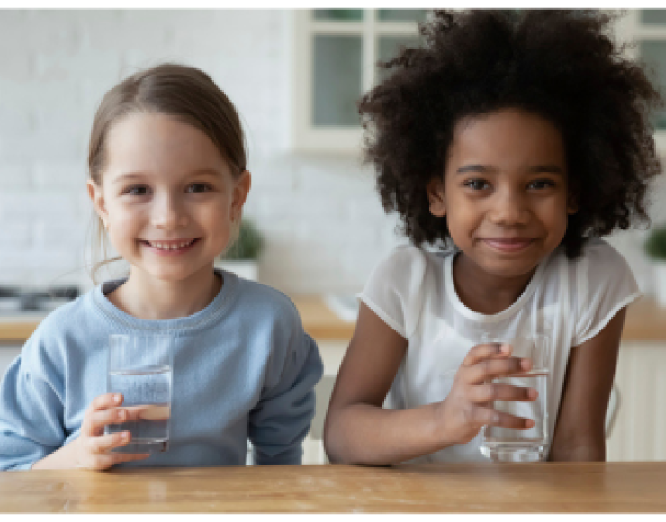 Image of two kids drinking water