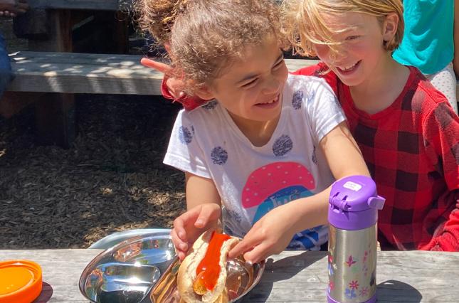 BUSD students enjoying lunch on stainless steel plates