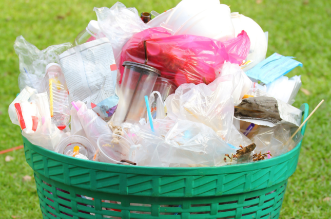 Image of overflowing garbage bin with plastic trash