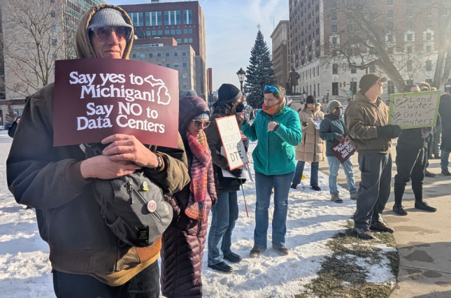 Protestors holding signs including "say yes to Michigan, say NO to data centers"