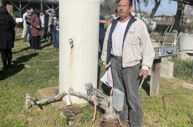 Community Water Tour in the San Joaquin Valley - Mr. Benitez next to his groundwater well