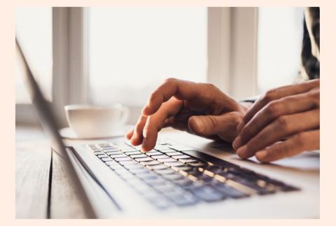 someone typing on a computer