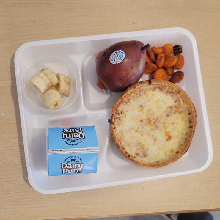 A school lunch served on a white styrofoam tray