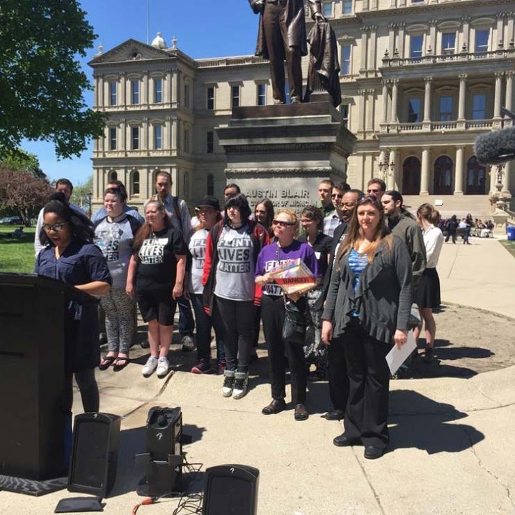 Nayyirah Shariff of Flint Rising addresses a press conference at the State Capitol on supplemental funding for Flint