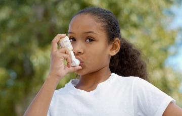 Young girl with inhaler