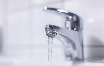 Image of a faucet and water