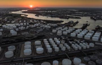 Chemical storage tanks along river