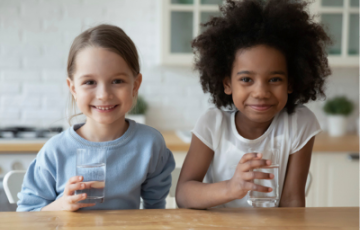 Image of two kids drinking water