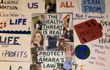 Collection of signs: "The Health Threat Is Real - Protect Amara's Law"
