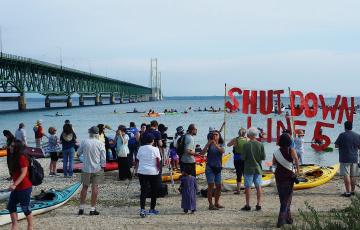 Shut Down Line 5 flotilla protest assembling under the Mackinac Bridge