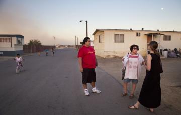 Rosanna Esparza (center) with residents in Kern County