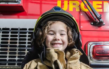 MA_istock_young-girl-wearing-fireman-coat-and-helmet.jpg