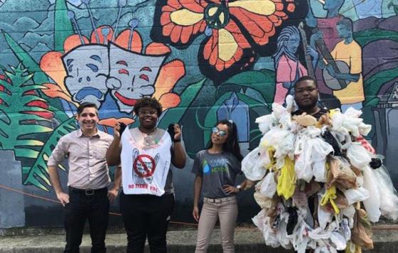 PA clean water action staff posing in front of a mural