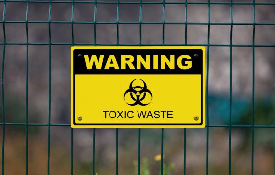 Image is of a Sign that Says Toxic Waste Warning. Source: Canva