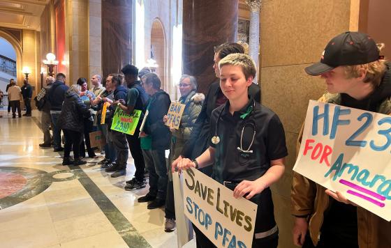 Rally outside MN legislature signs "Save lives stop PFAS" "for Amara"