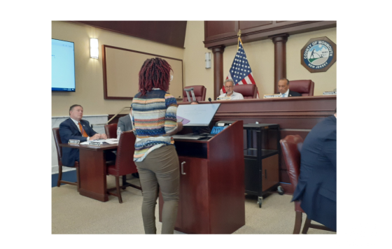 Image of Clean Water Action's Warehouse Organizer Tolani Taylor testifying in NJ