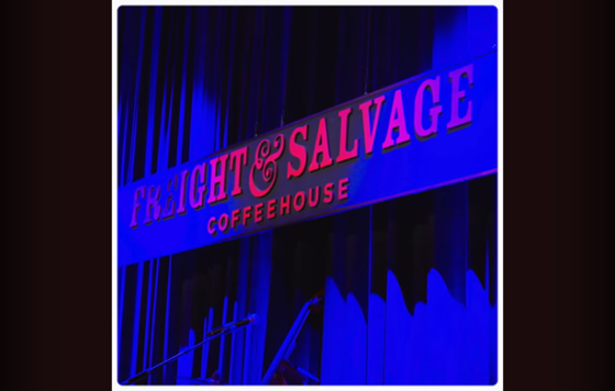 Freight & Salvage Coffeehouse stage sign lit in blue light.