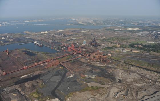 An aerial view of Sparrow's Point in Baltimore County, with the FSK Bridge and Baltimore City in the background.