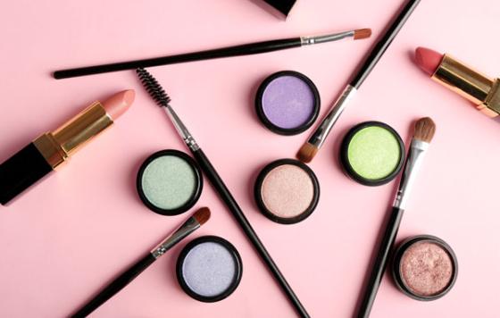 Cosmetics - lipstick, other makeup - arranged on a table